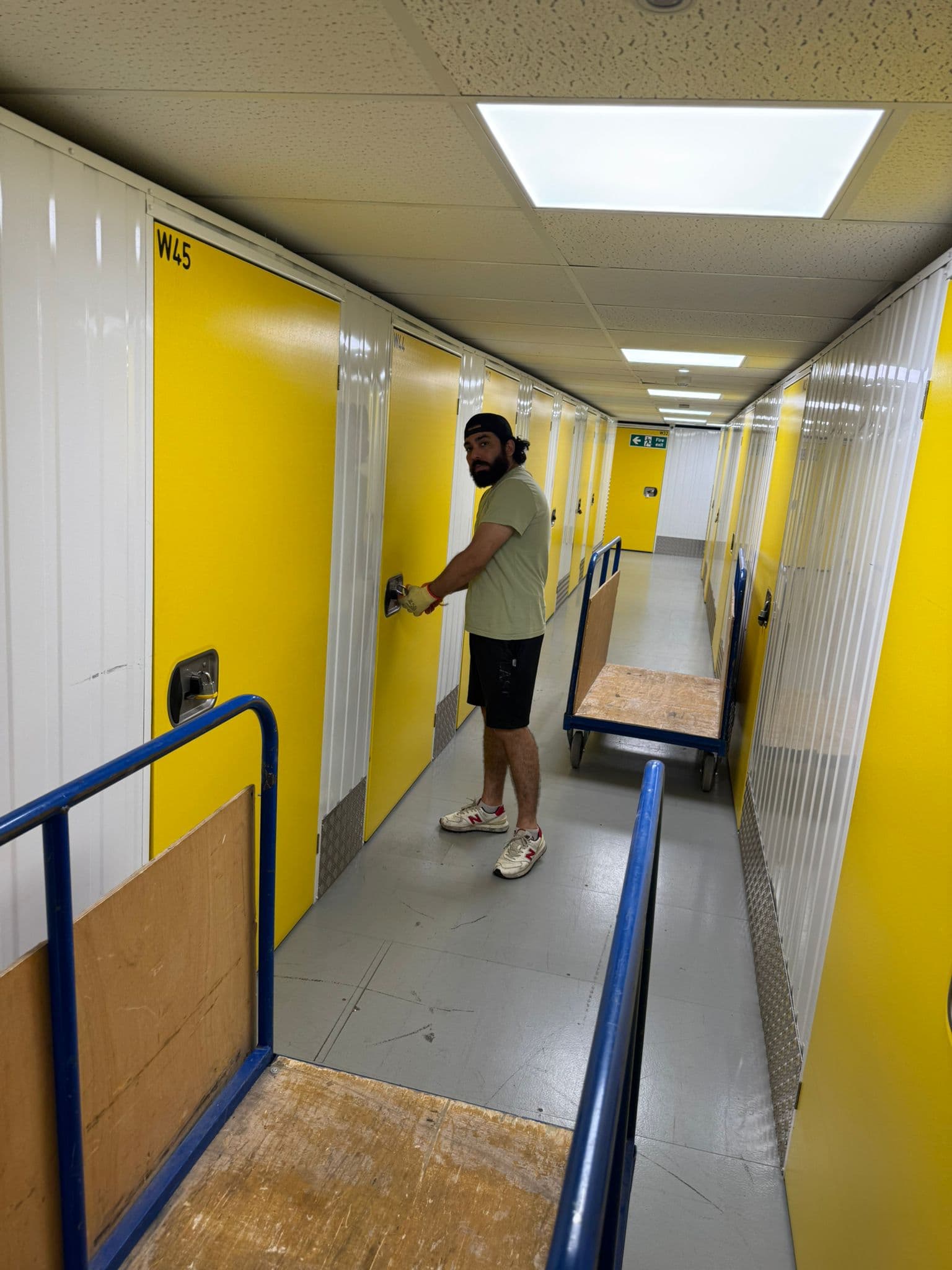 Packing service London — professional packer carefully wrapping household items in bubble wrap