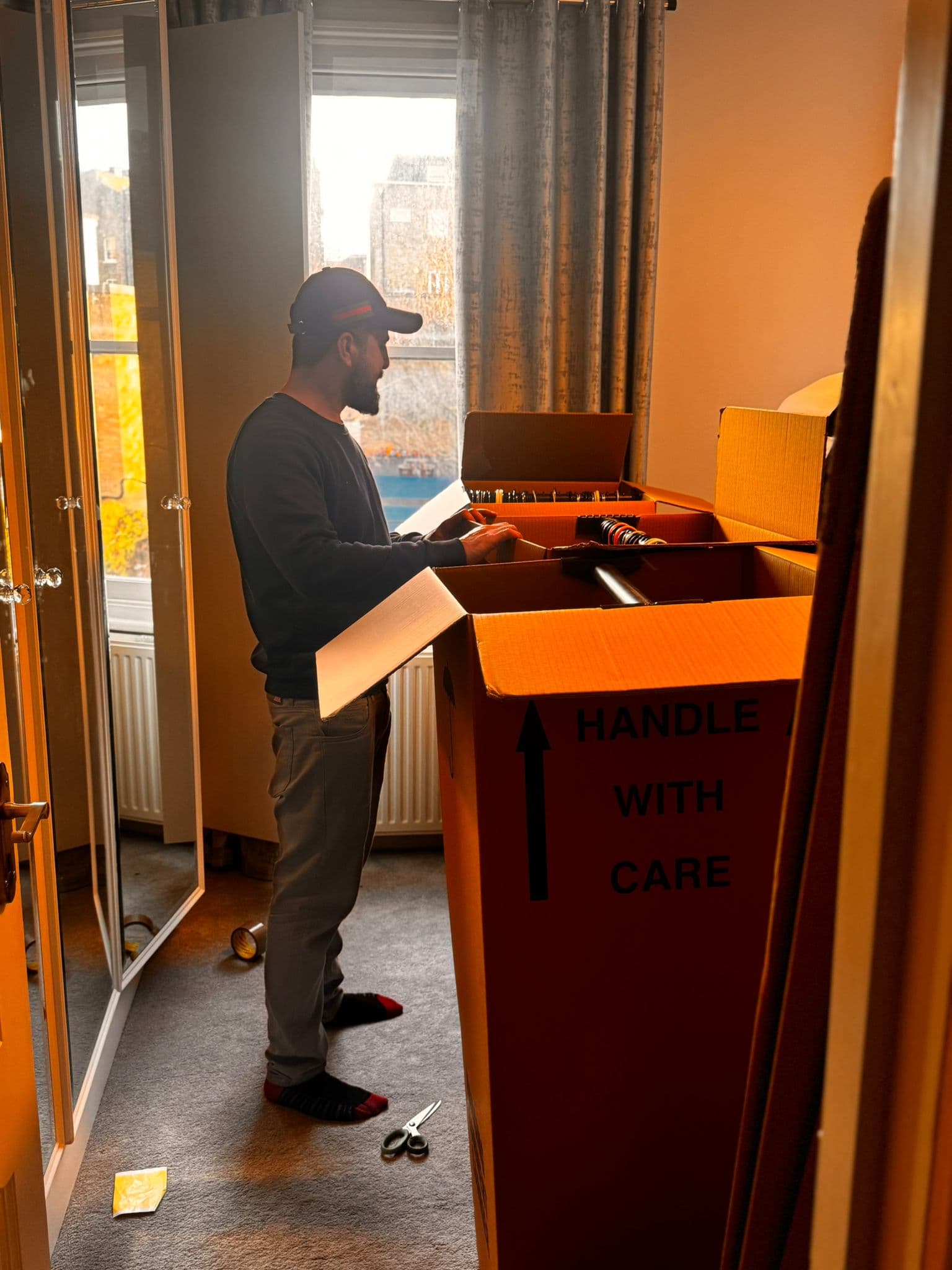 Professional movers London — trained DBS-checked removal team loading van with care